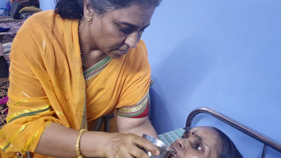 <div class="paragraphs"><p>Yojana Garat with an elderly person on bed</p></div>