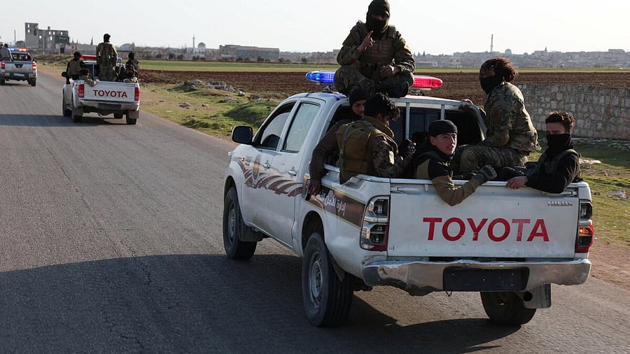 <div class="paragraphs"><p>Syrian army personnel travel in a military vehicle as they head towards Latakia to join the fight against the fighters linked to Syria's ousted leader Bashar al-Assad, in Aleppo.</p></div>