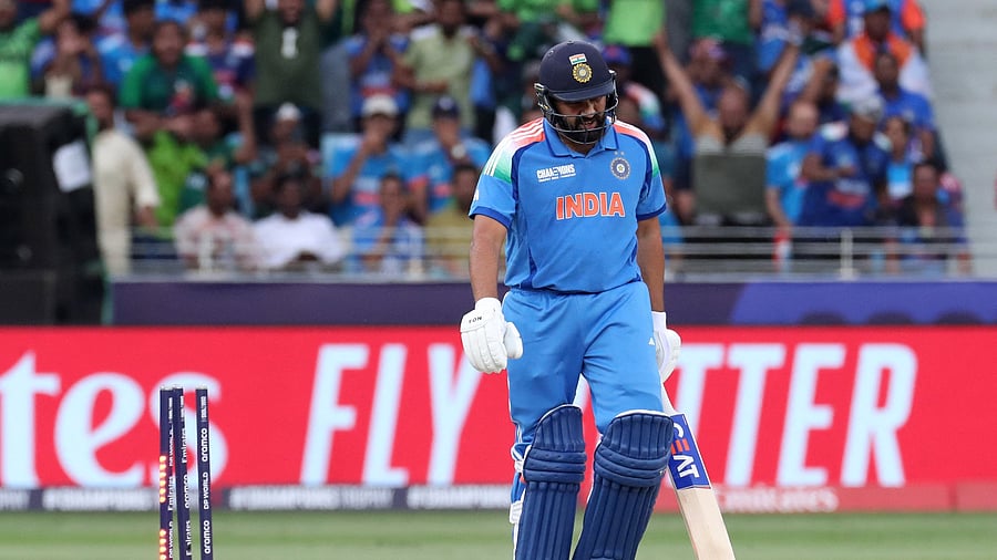 <div class="paragraphs"><p> India's Rohit Sharma looks dejected after being bowled out by Pakistan's Shaheen Shah Afridi </p></div>