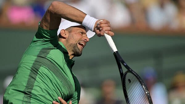 <div class="paragraphs"><p>Novak Djokovic (SRB) hits a shot against Botic Van De Zandschulp (not pictured) during the second round of the BNP Paribas Open at the Indian Well Tennis Garden.</p></div>