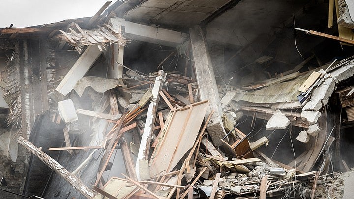 <div class="paragraphs"><p>At least two people were killed, and several others are feared trapped after a dilapidated shop collapsed in Belur on Sunday afternoon, police said.</p></div>