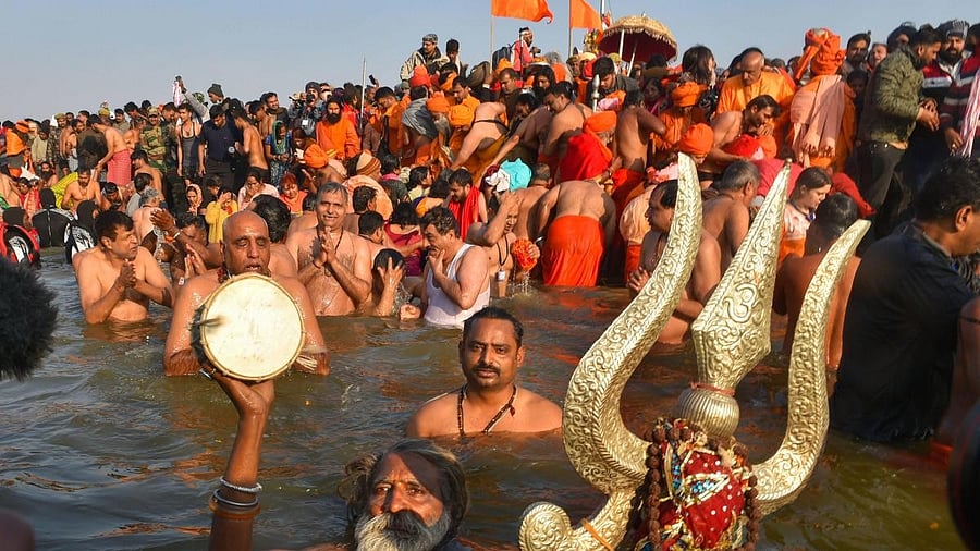 <div class="paragraphs"><p>Sadhus take holy dip in the River Ganga during Maha Kumbh&nbsp;</p></div>