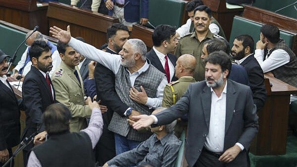 <div class="paragraphs"><p>Jammu and Kashmir National Conference MLA Irshad Rasool Kar, centre, during the Budget session of the J&K Assembly, in Jammu, on Monday.</p></div>