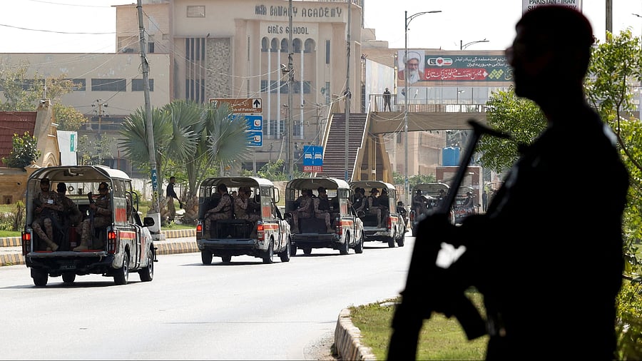 <div class="paragraphs"><p>A police officer is silhouetted as he stands guard while paramilitary forces patrol as a security measure. (Representative image)&nbsp;</p></div>