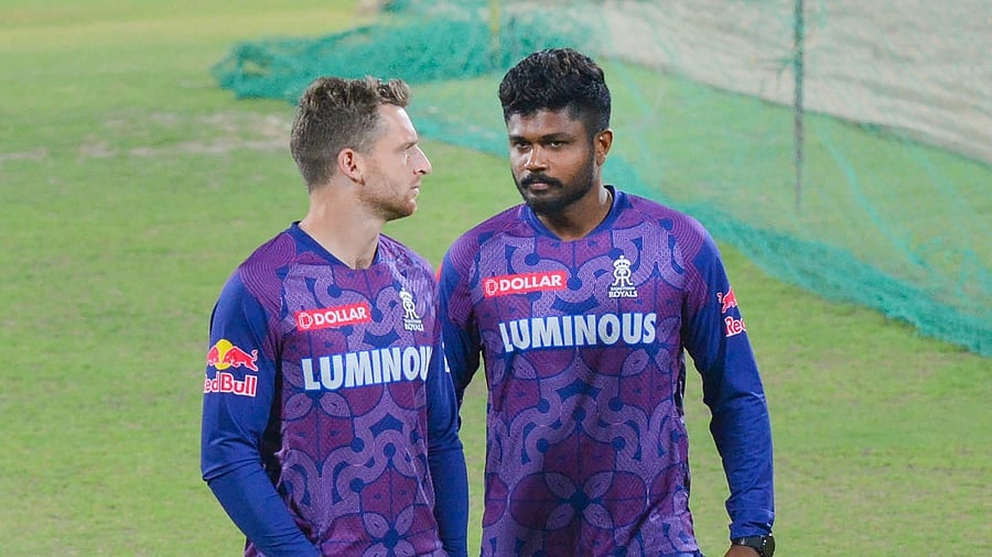 <div class="paragraphs"><p>Sanju Samson with Jos Buttler. </p></div>