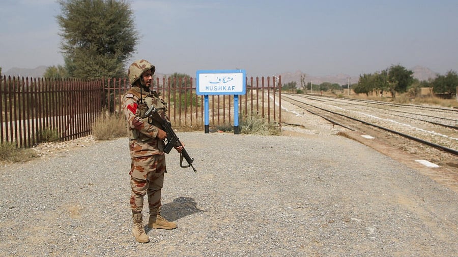 <div class="paragraphs"><p>A Pakistan Army soldier stands guard, after the attack on a train by separatist militants in Bolan, at the railway station in Mushkaf, Balochistan, Pakistan, March 12, 2025.</p></div>
