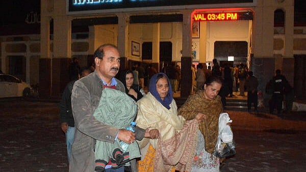 <div class="paragraphs"><p>Passengers who were rescued from a train after it was attacked by separatist militants, walk with their belongings at the Railway Station in Quetta, Balochistan, Pakistan, March 12, 2025.</p></div>