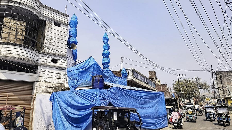 <div class="paragraphs"><p>A mosque covered in tarpaulin as prevention against possible holi colour, ahead of traditional 'Laat Saheb' procession on Holi, in Shahjahanpur</p></div>