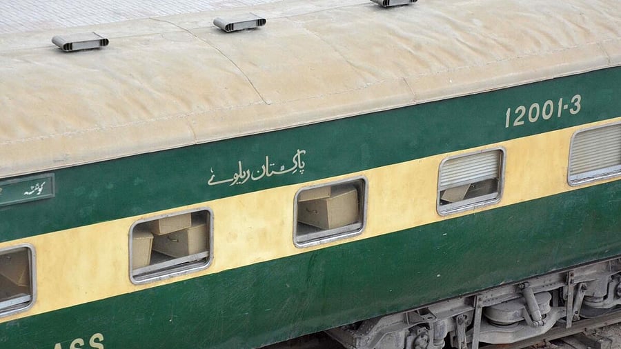 <div class="paragraphs"><p>A train containing empty coffins that are dispatched to Bolan where a passenger train that was attacked by separatist militants, is seen at a railway station in Quetta</p></div>