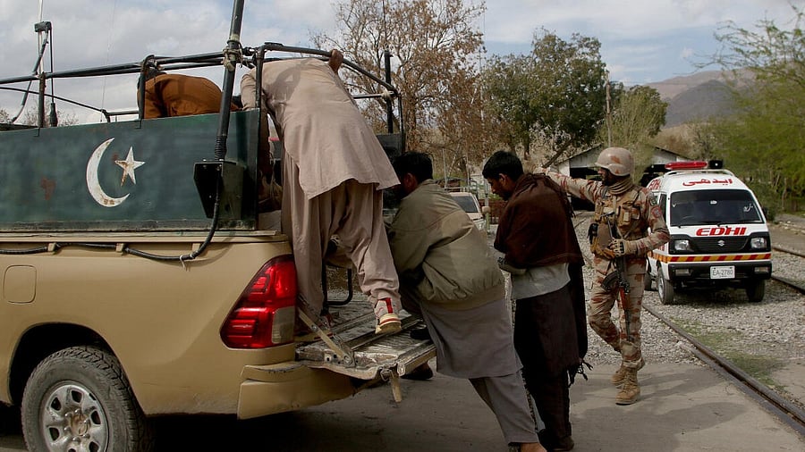 <div class="paragraphs"><p>Plain clothes security force perosnnel, who were rescued from a train after it was attacked by separatist militants, get into a vehcile following their arrival at a railway station in Mach, Balochistan</p></div>