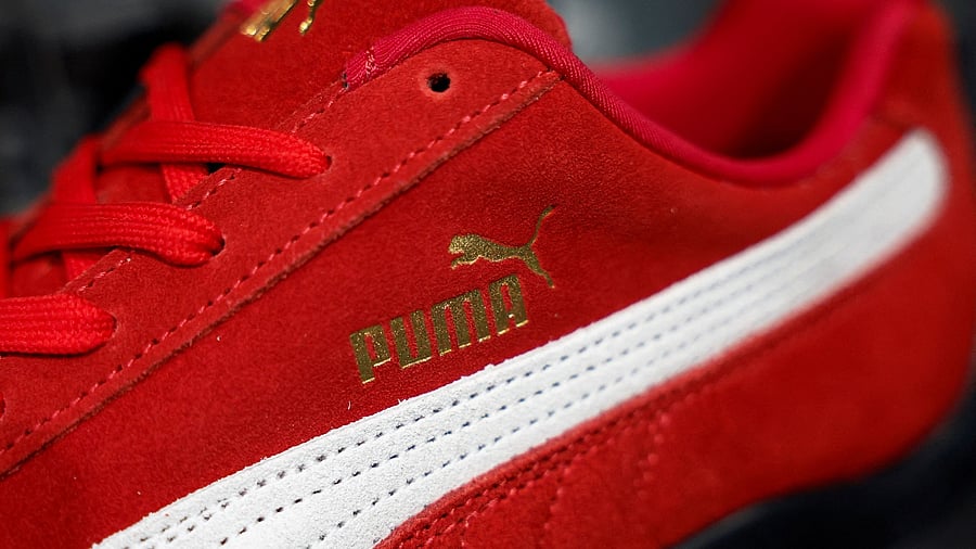 <div class="paragraphs"><p>A Puma Speedcat OG sneaker is displayed at a store in Paris</p></div>