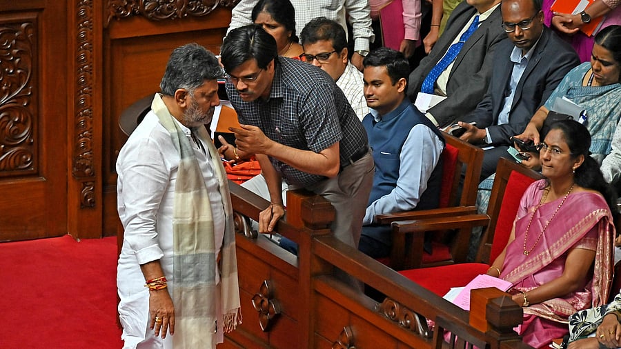 <div class="paragraphs"><p>Deputy Chief Minister D K Shivakumar obtains information from officials during a discussion in the Legislative Council on Thursday.</p></div>