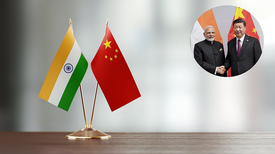 <div class="paragraphs"><p>India and China flags are seen here with inset image showing Modi and Xi</p></div>