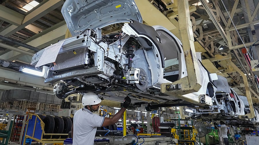 <div class="paragraphs"><p> Employees work in an assembly line at the joint manufacturing facility of Renault-Nissan Automotive India Pvt Ltd </p></div>