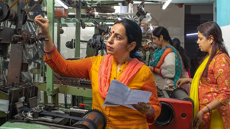 <div class="paragraphs"><p>Indian women working blue-collar jobs.</p></div>