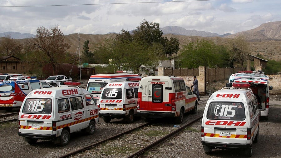 <div class="paragraphs"><p>Ambulances are parked outside a railway station where rescued and injured passengers of a train attacked by separatist militants are brought, in Mach, Balochistan, Pakistan</p></div>