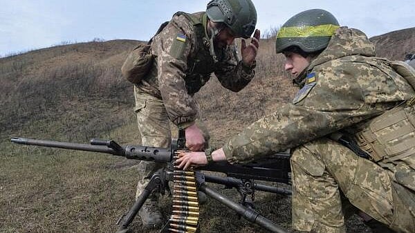 <div class="paragraphs"><p>Servicemen of the 57th Separate Motorized Infantry Brigade of the Ukrainian Armed Forces prepare to fare an American Browning M2 machine gun, amid Russia's attack on Ukraine, near the frontline town of Vovchansk in the Kharkiv region, Ukraine March 13, 2025.</p></div>