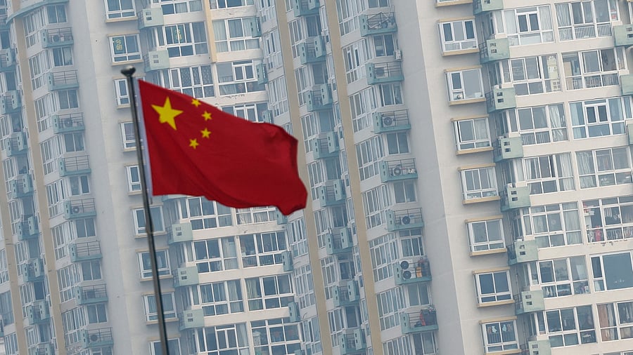 <div class="paragraphs"><p>A Chinese national flag flutters.</p></div>