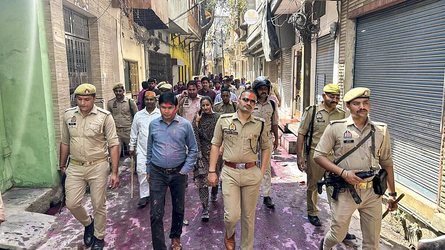 <div class="paragraphs"><p>Police personnel patrol in a sensitive area during the Holi festival, in Sambhal district, Uttar Pradesh, Friday, March 14, 2025.</p></div>