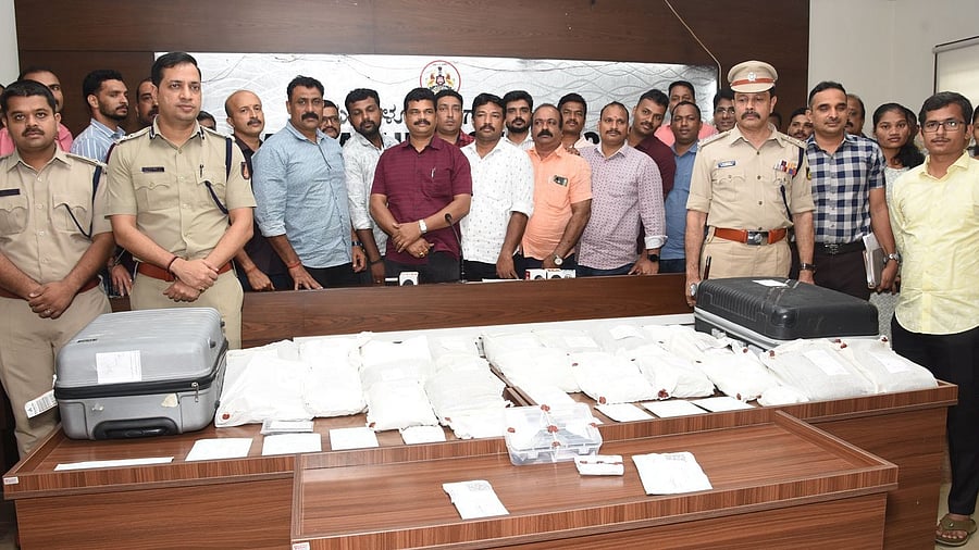 <div class="paragraphs"><p>Commissioner of Police Anupam Agrawal with CCB team members who were part of the arrest of South African nationals. </p></div>