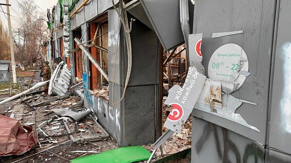 <div class="paragraphs"><p>A Russian service member stands next to a destroyed grocery store in the town of Sudzha, which was recently retaken by Russia's armed forces in the course of Russia-Ukraine conflict in the Kursk region, Russia.</p></div>