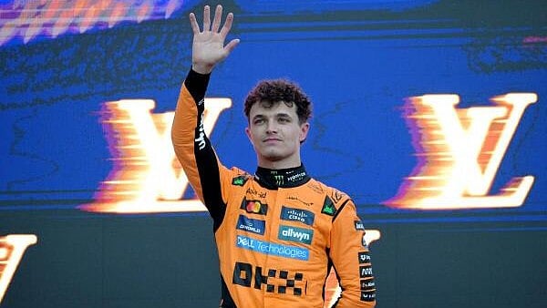 <div class="paragraphs"><p>McLaren's Lando Norris celebrates with the trophy on the podium after winning the Australian Grand Prix. </p></div>