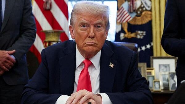 <div class="paragraphs"><p>US President Donald Trump signs an executive order in the Oval Office, at the White House in Washington.</p></div>