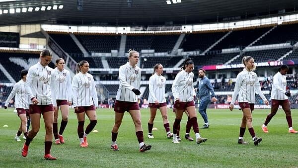 <div class="paragraphs"><p>Manchester City players during the warm up before the match Action</p></div>
