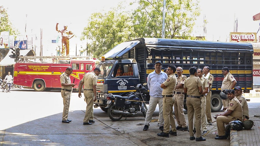 <div class="paragraphs"><p>Police personnel keep a vigil at Chitnis Park area amid curfew after violence erupted on Monday night, in Nagpur. </p></div>