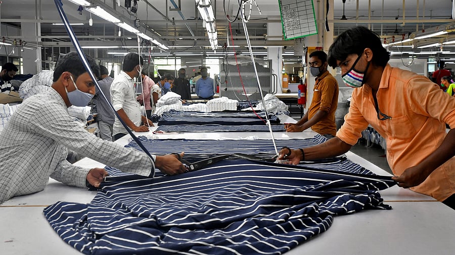 <div class="paragraphs"><p>Representative image: Garment workers cut fabric to make shirts at a textile factory of Texport Industries in Hindupur town in  Andhra Pradesh.. </p></div>