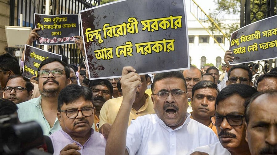 <div class="paragraphs"><p>BJP MLA and Leader of Opposition in the West Bengal Assembly Suvendu Adhikari shouts slogans during a protest outside the State Assembly, in Kolkata</p></div>