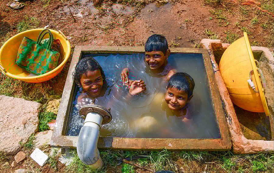 <div class="paragraphs"><p>Children play in water to beat the heat in Irakallagada village of Koppal taluk. </p></div>