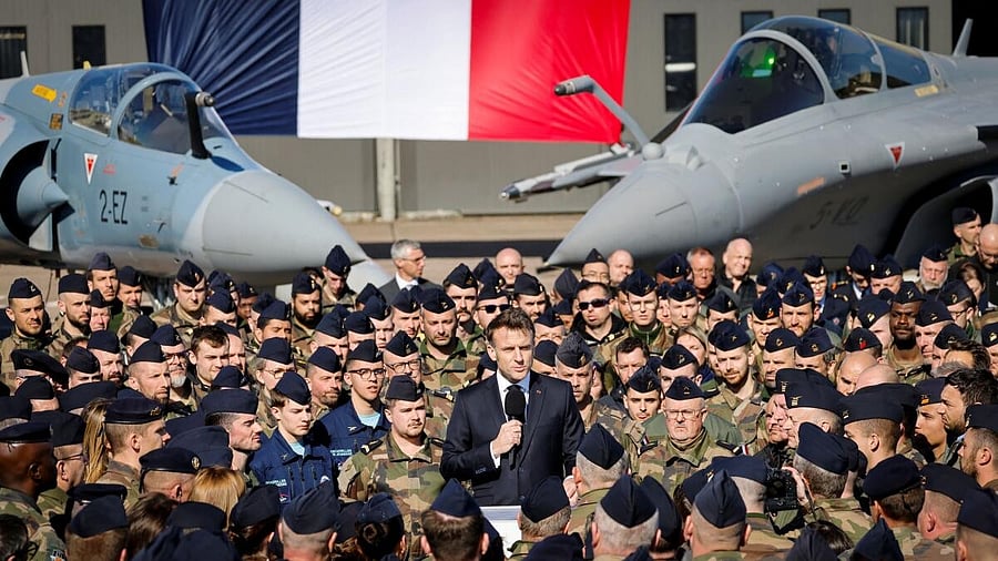 <div class="paragraphs"><p>France's President Emmanuel Macron delivers a speech in front of Dassault Rafale and Dassault Mirage 2000 fighter aircrafts during his visit to the French Air and Space Force</p></div>