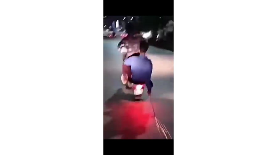 <div class="paragraphs"><p>A screen grab of the wheeling incident at Chowdeshwari Nagar where the miscreants dragged a long sword on the road to create sparks.  </p></div>