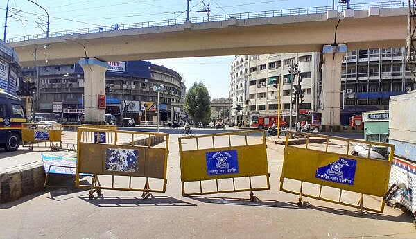 <div class="paragraphs"><p>A road closed with barricades amid curfew after violence erupted on Monday night, in Nagpur.</p></div>