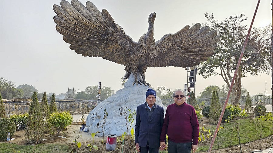 <div class="paragraphs"><p>A file image of Ram Sutar (left) and his son Anil in front of the statue of Jatayu made be them in Ayodhya. </p></div>
