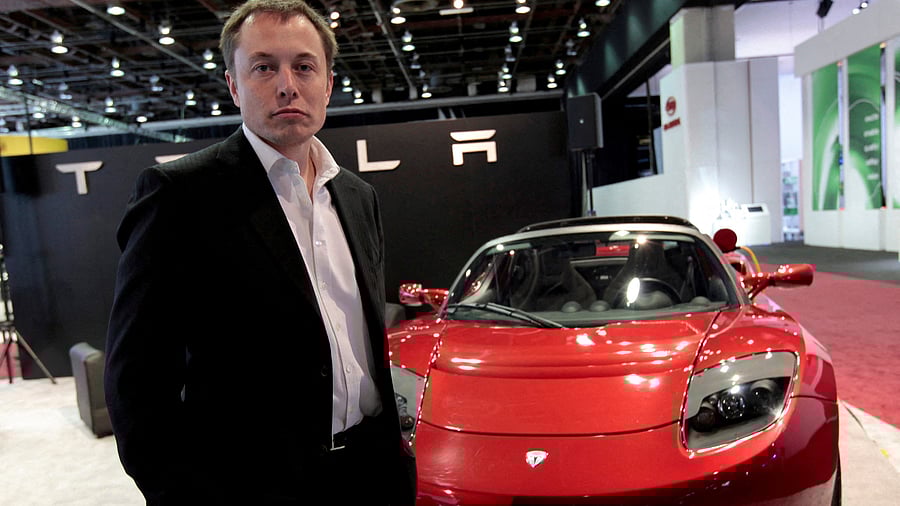 <div class="paragraphs"><p>Elon Musk stands in front of the Tesla Roadster electric vehicle   REUTERS/Rebecca Cook//File Photo</p></div>