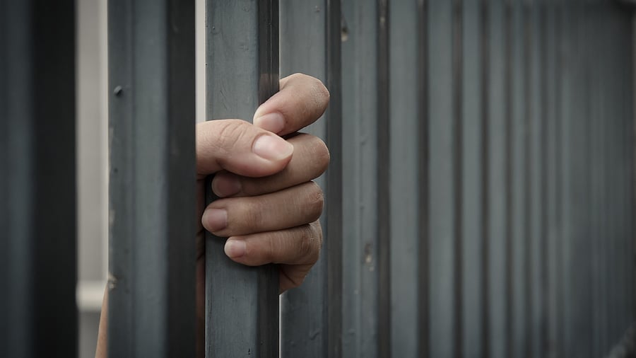 <div class="paragraphs"><p>Representative image showing a person behind bars.</p></div>