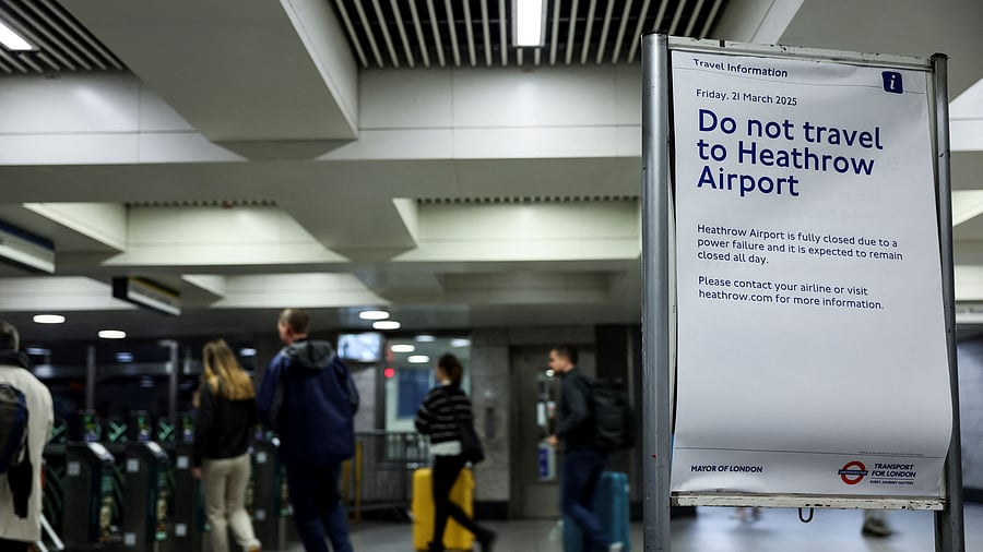 <div class="paragraphs"><p>A sign warning to not go to the Heathrow International Airport is placed at Victoria Underground Station, after a fire at electrical substation wiped out power at the Heathrow International Airport, in London, Britain, March 21, 2025.</p></div>