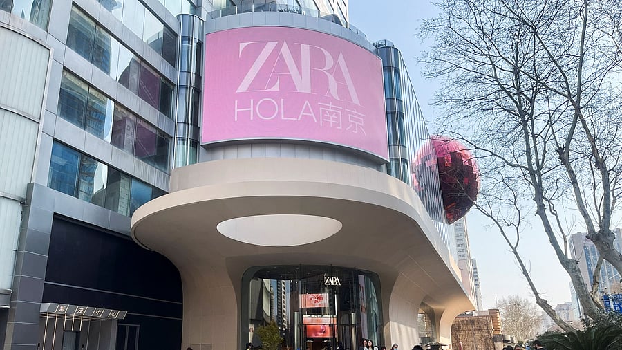 <div class="paragraphs"><p>People walk outside a newly opened Zara flagship store in Nanjing, Jiangsu province, China </p></div>