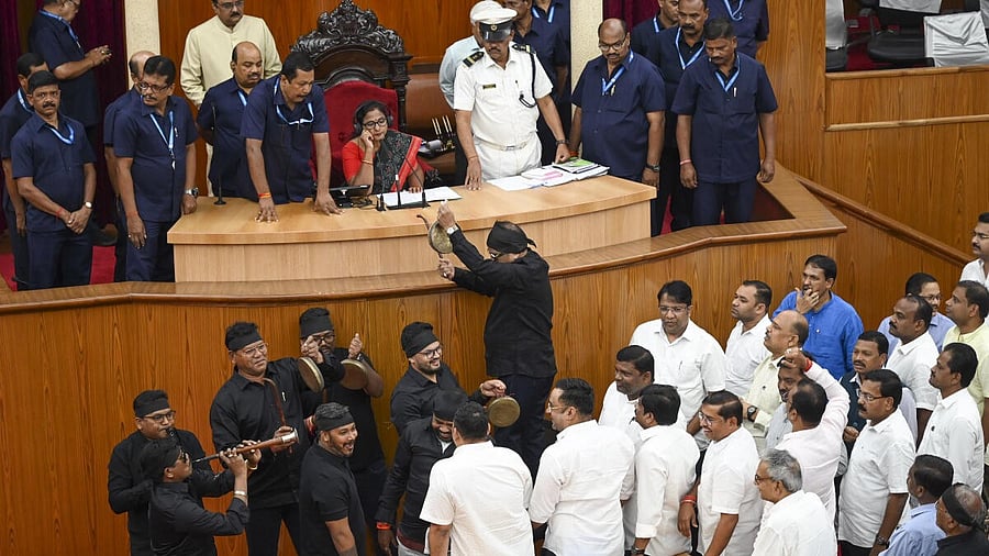 <div class="paragraphs"><p>Congress MLAs wearing black outfits play musical instruments during a protest in the Odisha Assembly, in Bhubaneswar.</p></div>