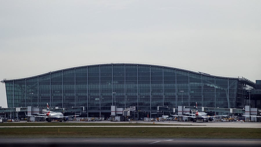 <div class="paragraphs"><p>Airplanes remain parked on the tarmac at Heathrow International Airport after a fire at a nearby electrical substation wiped out the power at the airport, near London, Britain, March 21, 2025.</p></div>