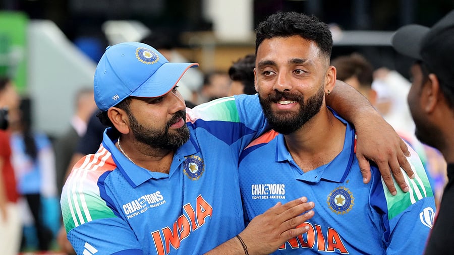 <div class="paragraphs"><p>India's Rohit Sharma and Varun Chakravarthy celebrate winning the ICC Men's Champions Trophy, March 9, 2025.</p></div>