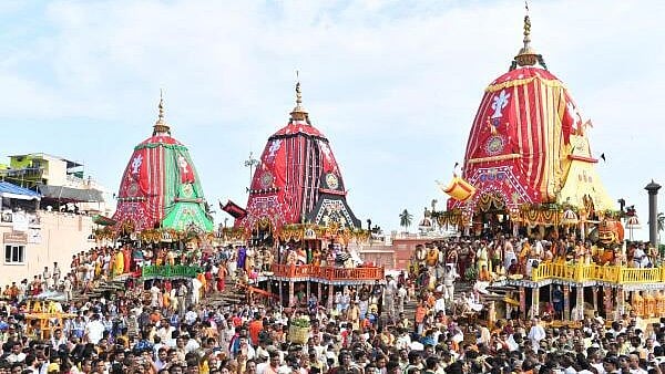 <div class="paragraphs"><p>Devotees take part in the annual Rath Yatra, in Puri.</p></div>