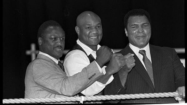 <div class="paragraphs"><p>Boxers Joe Frazier, George Foreman and Muhammad Ali, raise fists at launch of film Champions Forever exploring their lives London. October 17, 1989</p></div>