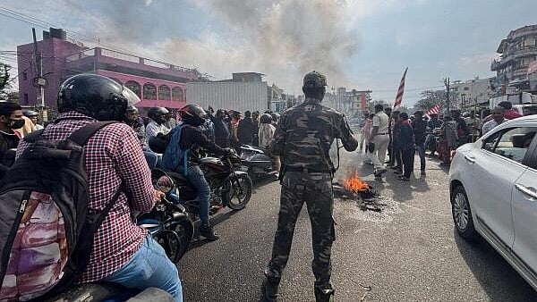 <div class="paragraphs"><p>Tribal people block the Ranchi-Jamshedpur road during ‘Ranchi bandh’ in protest against the construction of a flyover near a Sarna Sthal, a sacred tribal religious site, in Ranchi, Jharkhand, Saturday.</p></div>