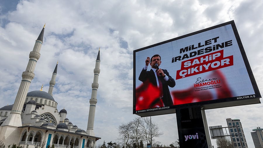 <div class="paragraphs"><p>A digital bilboard displays a picture of Istanbul Mayor Ekrem Imamoglu and a slogan which reads "The nation is standing up for its will", on the day Imamoglu was jailed as part of a corruption investigation, in Istanbul, Turkey, March 23, 2025. </p></div>