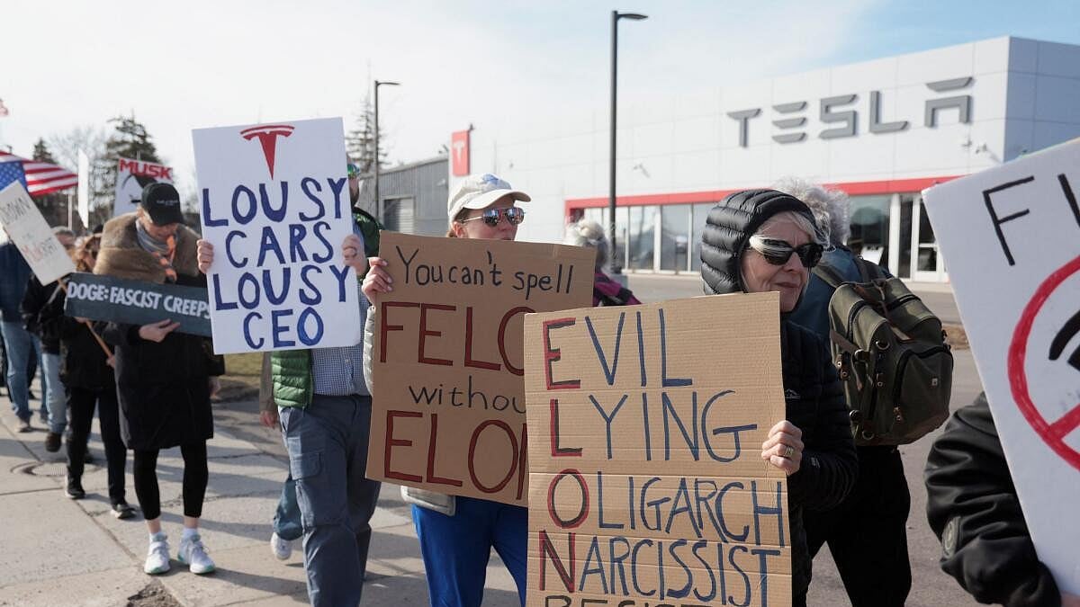 Anti-Musk protesters gather outside Tesla dealership in Washington