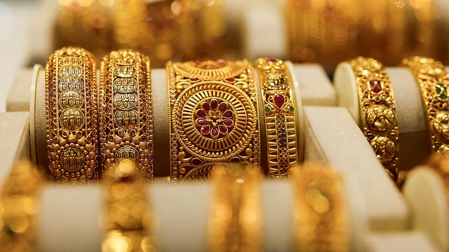 <div class="paragraphs"><p> Gold bangles are displayed at a jewellery store</p></div>
