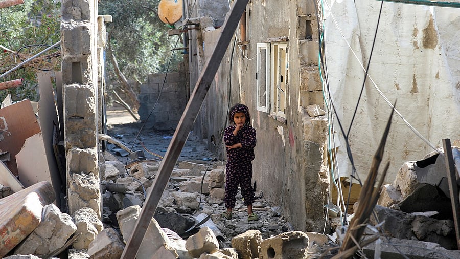 <div class="paragraphs"><p>A Palestinian girl inspects the damage at the site of an Israeli strike on a house, in Deir Al-Balah in the central Gaza Strip, March 25, 2025. </p></div>